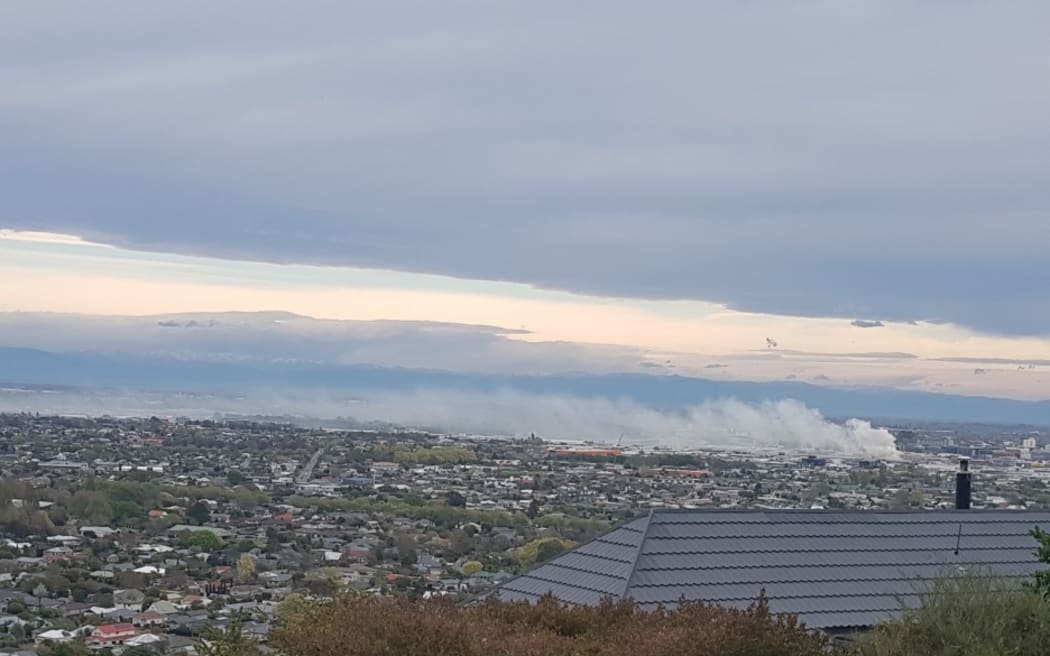 A large fire at a car workshop in Christchurch's Sydenham caused smoke to billow across the city