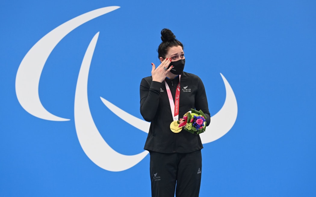 Sophie Pascoe wipes away tears after winning gold 100 freestyle Tokyo Paralympics.
