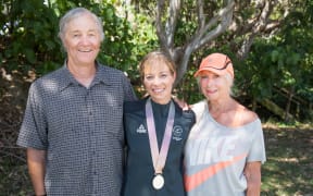 Alana Barber (centre) with her parents David (left) and Shirley Barber (right).