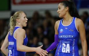 Laura Langman and Maria Tutaia of the Mystics celebrate the win.