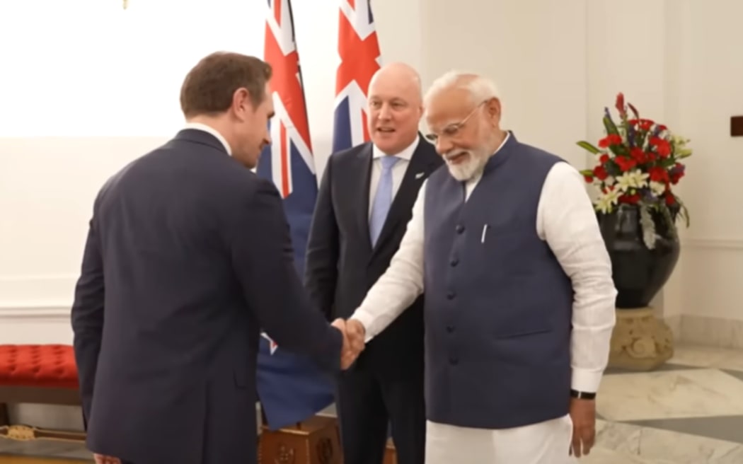Prime Minister Christopher Luxon's deputy chief press secretary Michael Forbes shaking hands with India Prime Minister Narendra Modi.