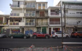 A photo taken on April 10, 2024 shows a street in a neighborhood of the city of Point-a-Pitre on the French Caribbean island of Guaedloupe. (Photo by Cedrick-Isham CALVADOS / AFP)