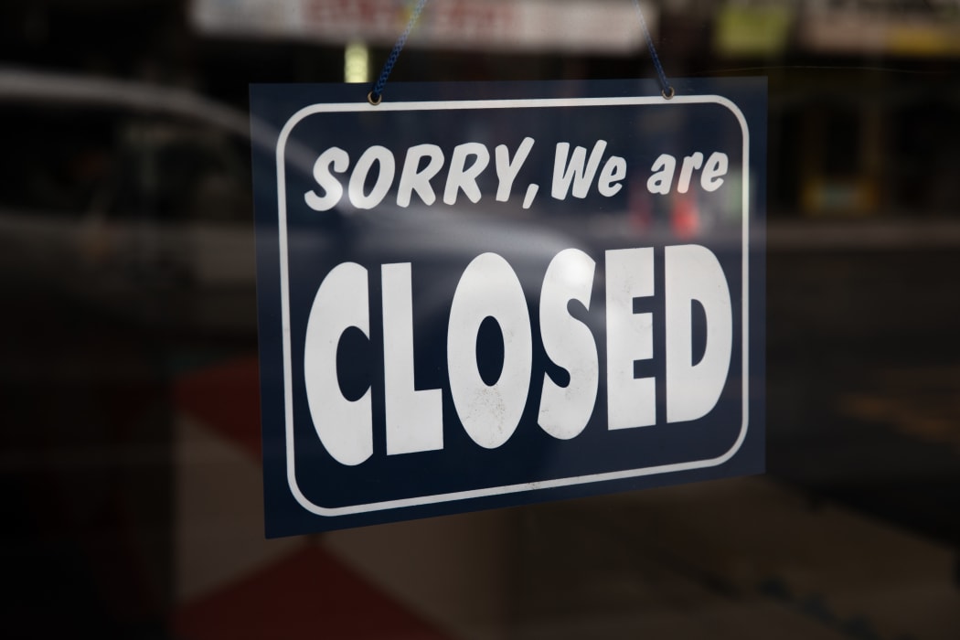 Sign that reads 'Sorry, We are closed' hanging in a shop front in Central Auckland during Lockdown Level 3.