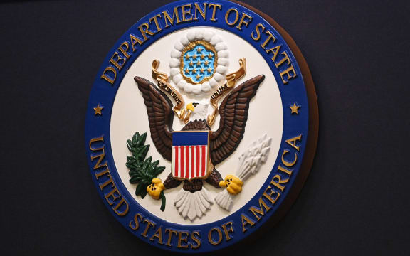 The State Department seal is seen on the briefing room lectern ahead of a briefing by State Department spokesperson Ned Price at the State Department in Washington, DC, on January 31, 2022. (Photo by MANDEL NGAN / POOL / AFP)