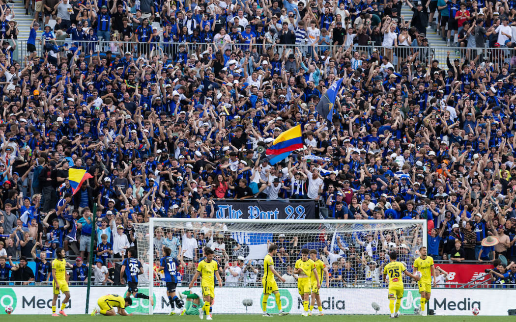 Auckland FC supporters celebrate their second goal during the A-League football match between Auckland FC v Wellington Phoenix held at Go Media Stadium - Auckland.