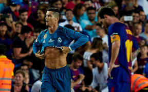 Cristiano Ronaldo earns his first yellow of the match for taking his shirt off.