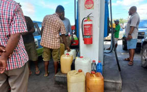 People line up at Puma energy service stations to get fuel. February 2023.