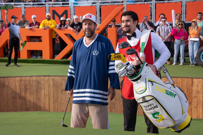 Adam Sandler as Happy Gilmore and Benito Antonio Martínez Ocasio as Oscar Mejias in Happy Gilmore 2