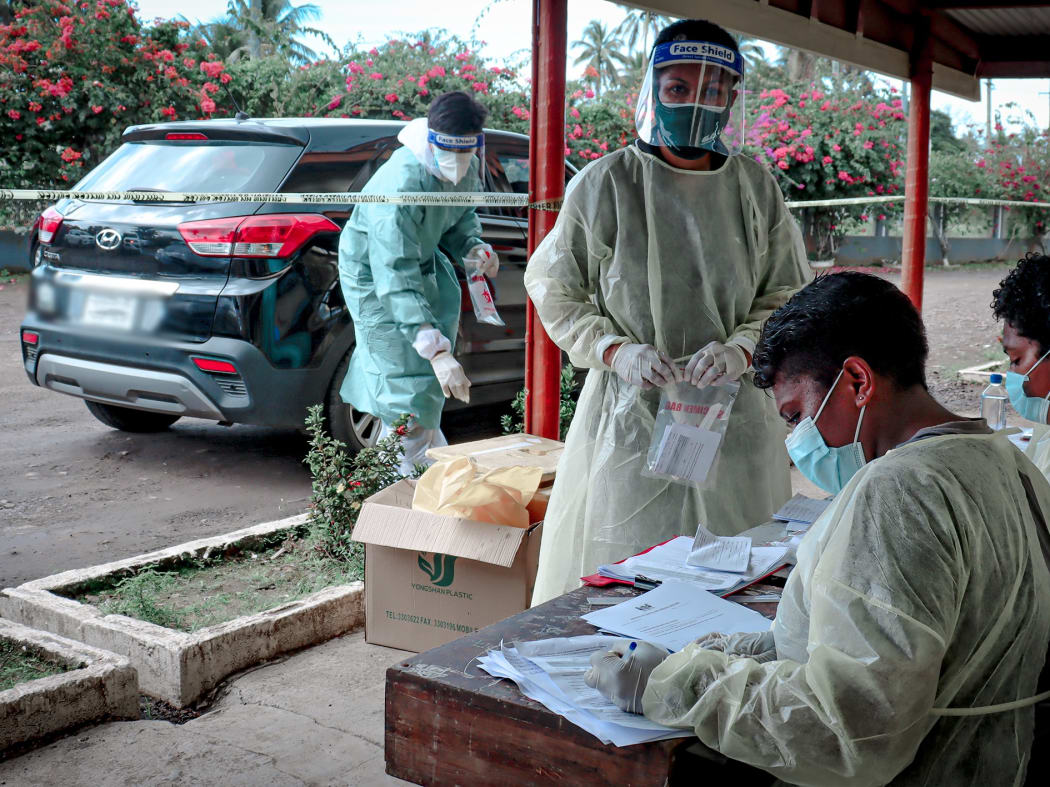 Front-line workers at the swab drive-through in Vunimono, Nausori.