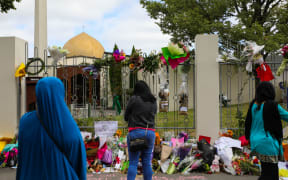 People gather outside Al Noor Mosque