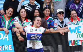 Marine Puketapu of the Warriors poses with with her supporters in the crowd after the Sydney Roosters Women v NZ Warriors Women.