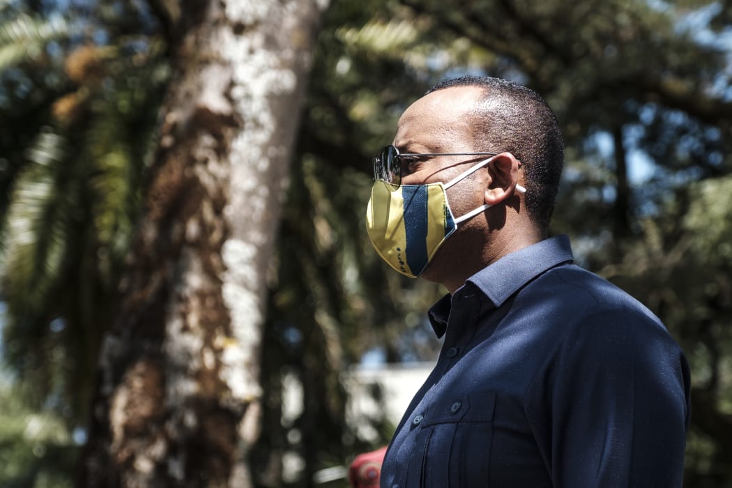 Abiy Ahmed, Prime Minister of Ethiopia, stands during an event to honour the national defence forces in Addis Ababa, on November 17, 2020.