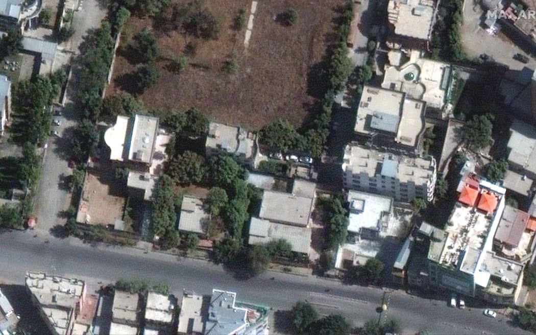 This handout image courtesy of Maxar Technologies released on August 2, 2022 and taken on October 13, 2021 shows the builiding (L) in which Al-Qaeda chief Ayman al-Zawahiri was probably located at the time of the strike that killed him in Kabul. - A United States drone strike killed Al-Qaeda chief Ayman al-Zawahiri at a hideout in Kabul, President Joe Biden said August 1, 2022, declaring "justice had been delivered" to the families. (Photo by Satellite image ©2022 Maxar Technologies / AFP) / RESTRICTED TO EDITORIAL USE - MANDATORY CREDIT "AFP PHOTO / Satellite image ©2022 Maxar Technologies" - NO MARKETING NO ADVERTISING CAMPAIGNS - DISTRIBUTED AS A SERVICE TO CLIENTS