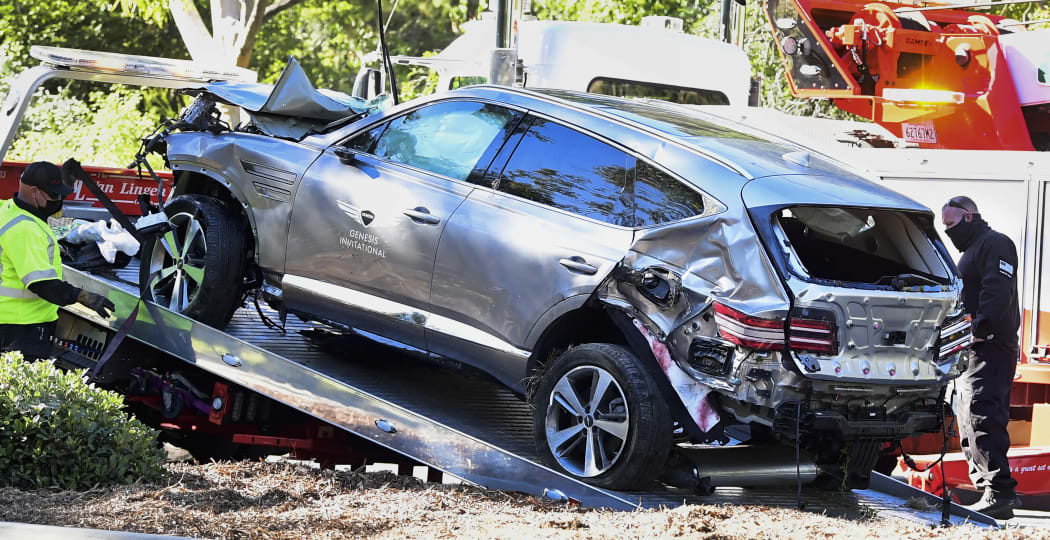 A tow truck recovers the vehicle driven by golfer Tiger Woods in Rancho Palos Verdes, California.