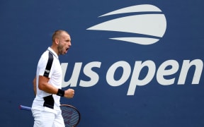 Dan Evans of Great Britain reacts after winning a point against Karen Khachanov of Russia during their marathon first round match at the US Open.