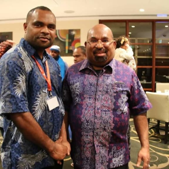 Laurens Ikinia with Governor of West Papua Lukas Emembe