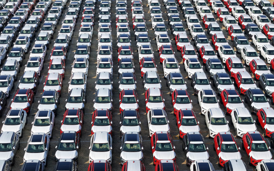 A large number of Chinese-made vehicles gather at Yantai Port waiting to be loaded for export in Yantai, China, on October 23, 2024. (Photo by Costfoto/NurPhoto) (Photo by CFOTO / NurPhoto / NurPhoto via AFP)