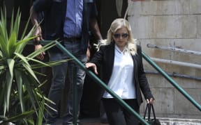 Sara Netanyahu, wife of Israeli Prime Minister Benjamin Netanyahu, leaves the Magistrate's Court in Jerusalem on June 16, 2019, following her conviction of fraudulently using state funds for catering.