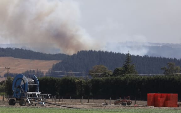 Clouds of smoke are seen rising from the bush fire area at Pigeon Valley this afternoon.