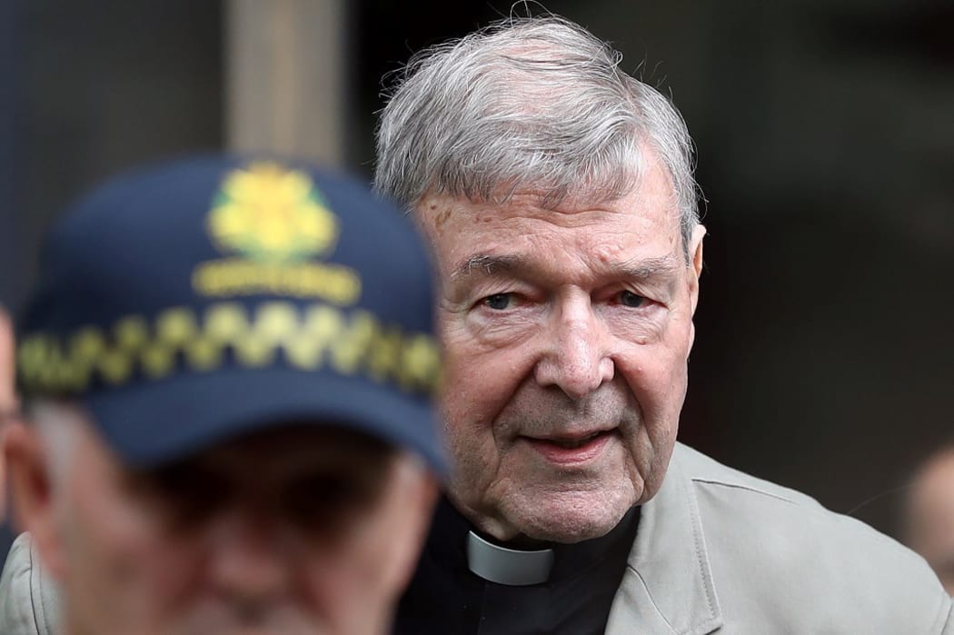 File photo taken on February 26, 2019 shows Cardinal George Pell (R) leaving the County Court of Victoria court in Melbourne