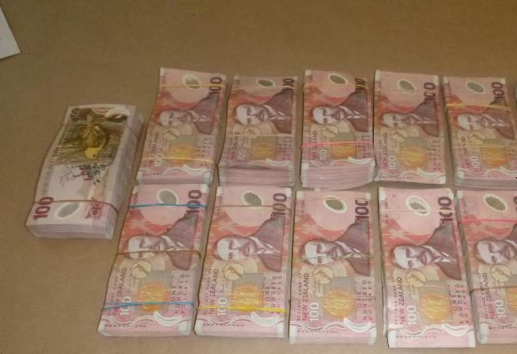 One person was found with almost $400,000 cash, during hte police raid.