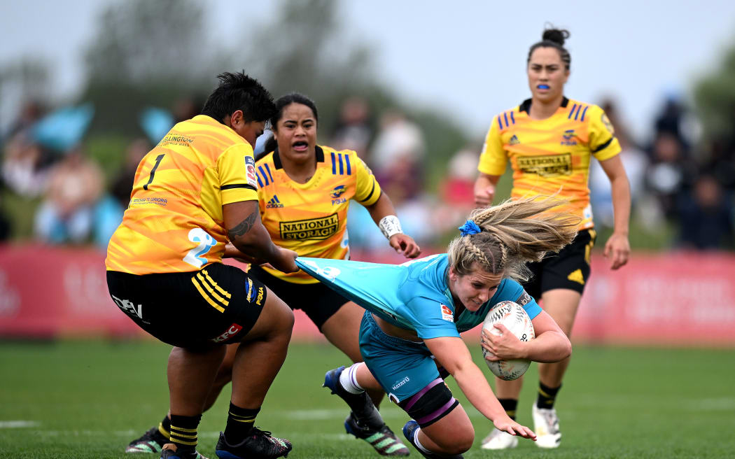 Alana Bremner of Matatu is tackled by Krystal Murray of the Hurricanes Poua during the round two Super Rugby Aupiki match