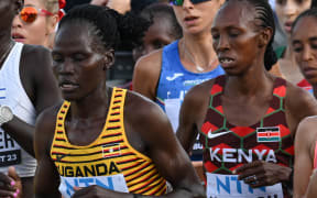 (FILES) (From L to R) Kenya's Rosemary Wanjiru, Israel's Lonah Chemtai Salpeter, Uganda's Rebecca Cheptegei and Kenya's Selly Chepyego Kaptich compete in the women's marathon final during the World Athletics Championships in Budapest on August 26, 2023. A Ugandan marathoner who competed at the Paris Olympics is in intensive care after  being set on fire alledgedly by her partner in Kenya, officials said on September 3, 2024, the latest horrific incident of gender-based violence in the East African country.
Long-distance runner Rebecca Cheptegei, 33, was assaulted after her Kenyan partner Dickson Ndiema Marangach reportedly snuck into her home in western Trans-Nzoia county on September 1, 2024 at around 2:00 pm while she and her children were at church, police said. (Photo by Ferenc ISZA / AFP)