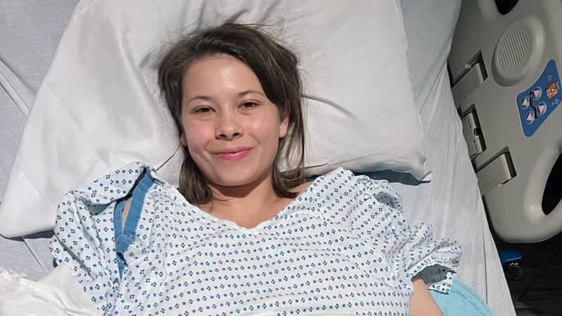 Bindi Irwin lying in hospital bed.