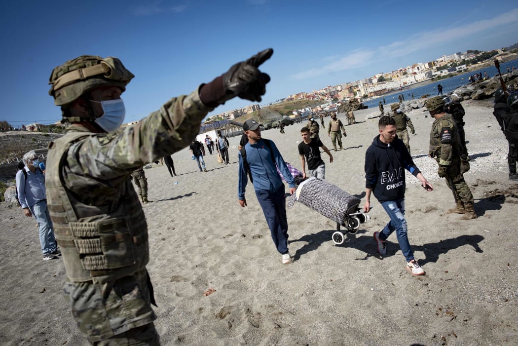 Spain deployed solders as migrants arrived entered the Spanish territory of Ceuta from Morocco, 18 May 2021.