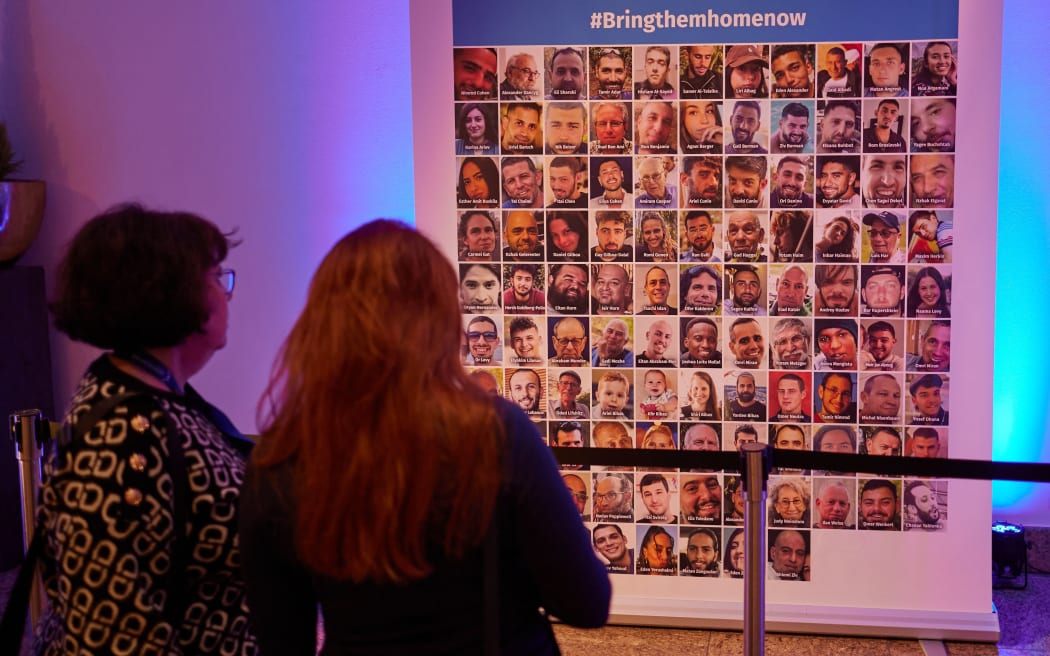 14 December 2023, Berlin: A poster with photos of the Hamas hostages can be seen at the Jewish Community Day 2023 at the Intercontinental Hotel. From December 14 to 17, the Central Council of Jews in Germany is inviting members of Jewish communities from all over Germany to the Community Day in Berlin, which this year is being held under the motto "Living Together". Photo: Joerg Carstensen/dpa (Photo by Jörg Carstensen / DPA / dpa Picture-Alliance via AFP)