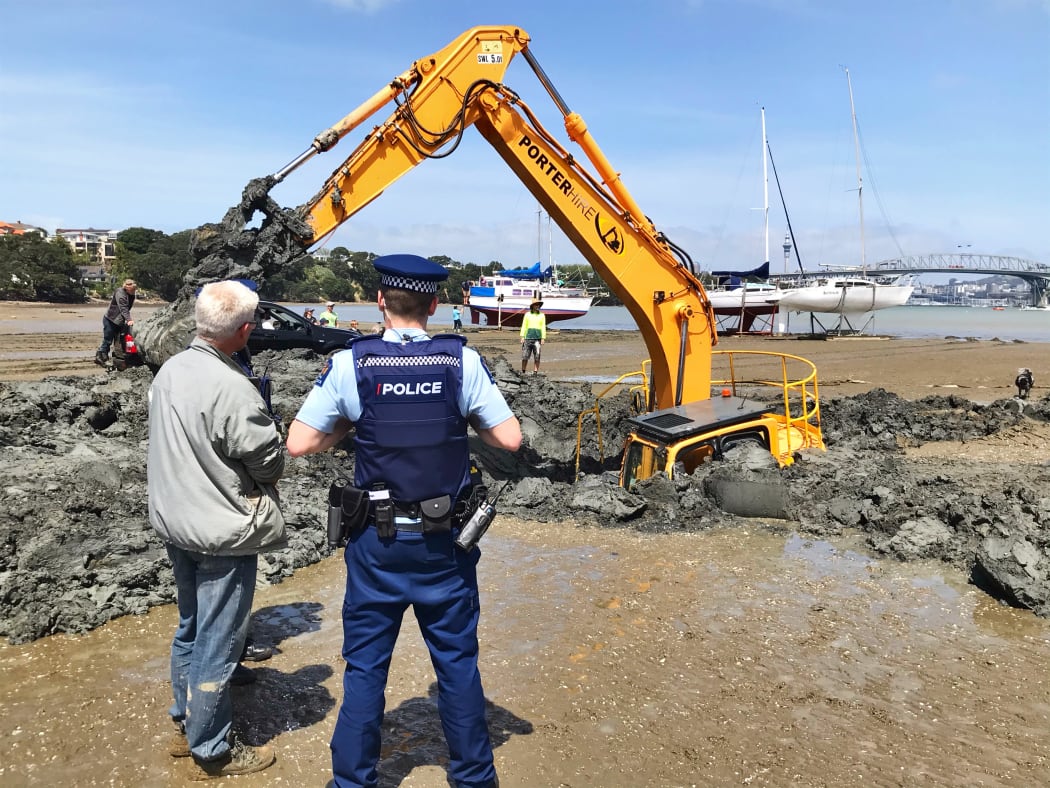 The digger has been stuck in the mud for four days.