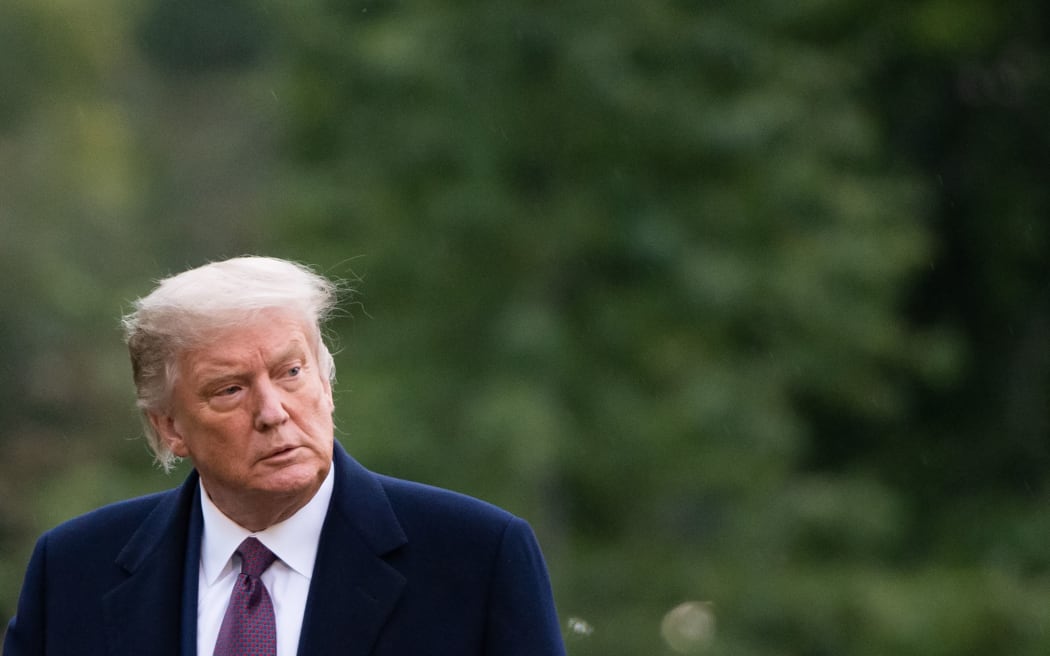 US President Donald Trump walks from Marine One after arriving on the South Lawn of the White House in Washington, DC, October 1, 2020,