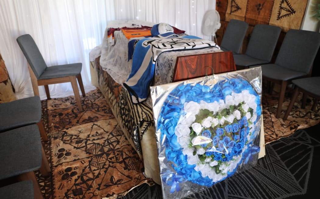 Fa'asala Sam Matue's coffin, with jerseys from his favourite teams