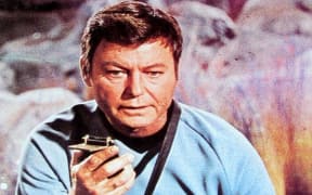 'Bones' McCoy with tricorder on cover of Star Trek magazine 1977