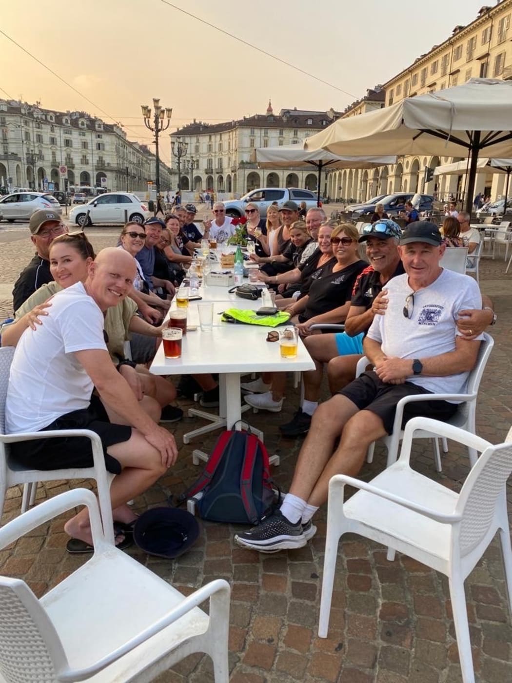 A group drinks in Italy after a big bike tour of the city.