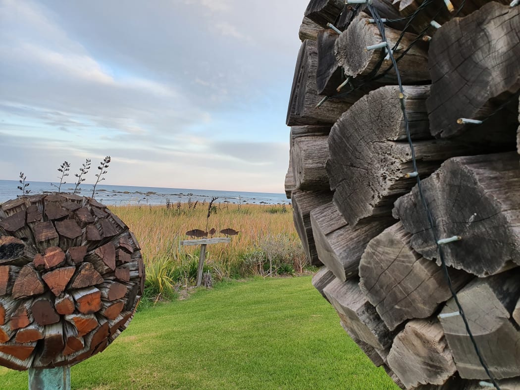 Giant golf balls made of totara and old copper tanks made by artist plumber Jeff Burnett