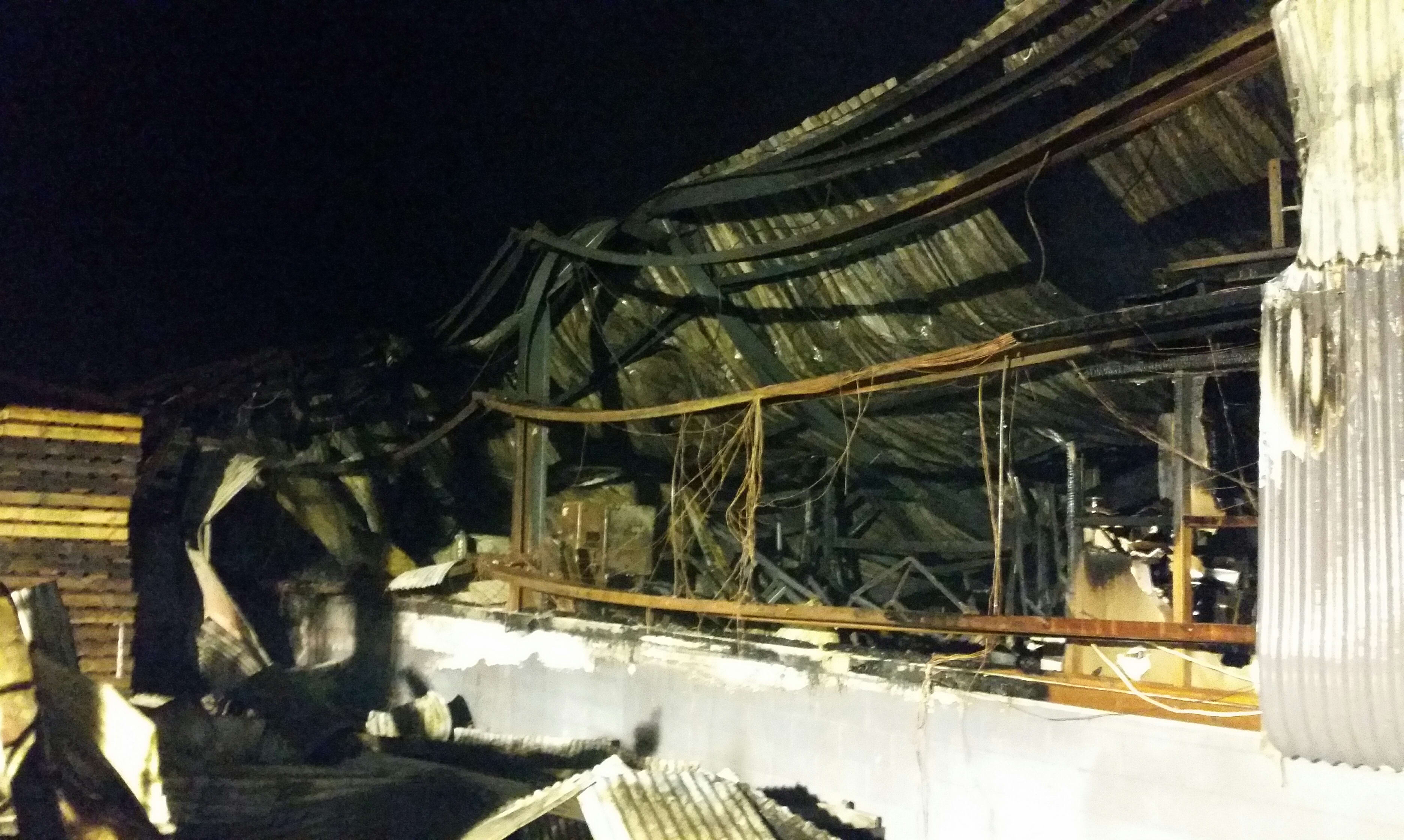 The charred exterior of the Total Plastics factory building in Henderson.