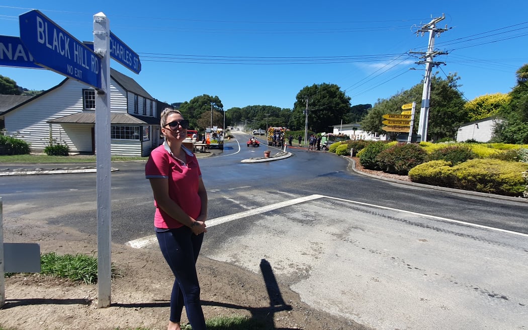 Melissa Hanson at the Tīnui crossroads on Sunday, which mark the peak of where the Cyclone Gabrielle floodwaters waters reached on Tuesday 14 February 2023.