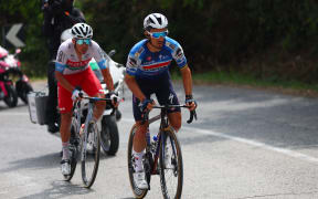 Team Soudal-Quick Step's French rider Julian Alaphilippe (R) and Team Polti-Kometa's Italian rider Mirco Maestri climb during the 12th stage of the 107th Giro d'Italia cycling race, 193km between Martinsicuro and Fano, on May 16, 2024. (Photo by Luca Bettini / AFP)