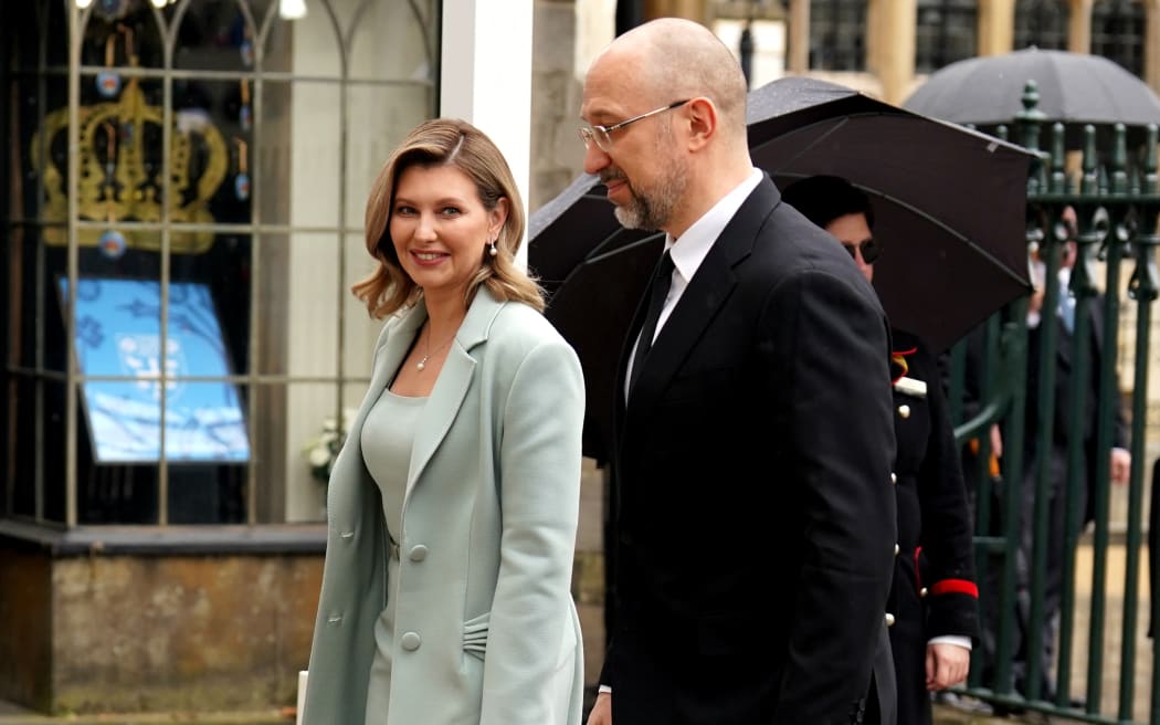 Ukraine's First Lady Olena Zelenska and Ukraine's Prime Minister Denys Shmyhal arrive at Westminster Abbey in central London on May 6, 2023, ahead of the coronations of Britain's King Charles III and Britain's Camilla, Queen Consort. - The set-piece coronation is the first in Britain in 70 years, and only the second in history to be televised. Charles will be the 40th reigning monarch to be crowned at the central London church since King William I in 1066. Outside the UK, he is also king of 14 other Commonwealth countries, including Australia, Canada and New Zealand. Camilla, his second wife, will be crowned queen alongside him, and be known as Queen Camilla after the ceremony. (Photo by Andrew Milligan / POOL / AFP)