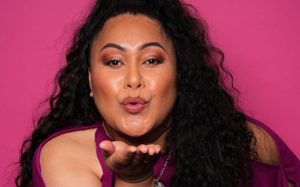 Bella Kalolo blows a kiss at the camera.