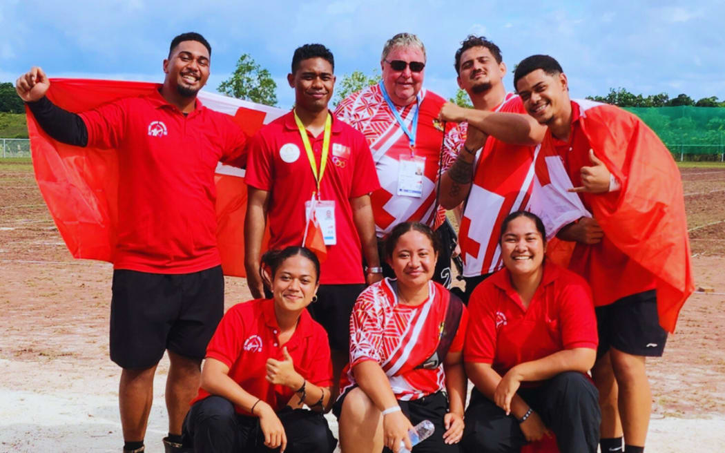 Hans Arne Jensen with Team Tonga archers at the Palau Mini Games.