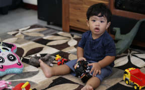 Little Frederick became big news both in NZ and Samoa after he was denied a vaccination in New Zealand before travelling home to Samoa. That is despite the NZ government sending 100,000 vaccines to the Island nation. He is being kept quarantined at his godparents home until the epidemic is over.