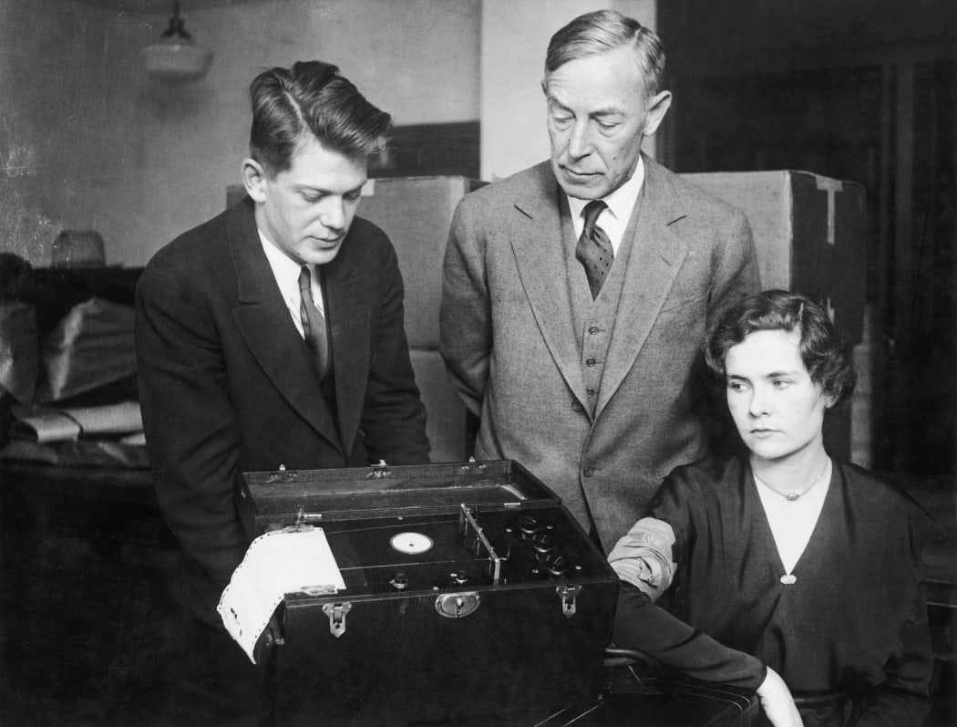 Leonarde Keeler (Left), who helped develop the lie detector polygraph, testing the device on Marjorie Creighton in presence of August Vollmer during a trial Chicago in 1932.