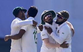 Bangladesh’s cricketers celebrate after winning the first Test cricket match between Bangladesh and New Zealand at the Sylhet International Cricket Stadium in Sylhet 2023.