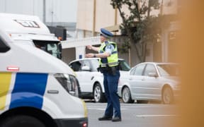 Police direct traffic on road diversions after a fire broke out at the SkyCity convention centre.