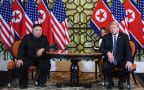 US President Donald Trump (R) and North Korea's leader Kim Jong Un hold a meeting during the second US-North Korea summit at the Sofitel Legend Metropole hotel in Hanoi on February 28, 2019.