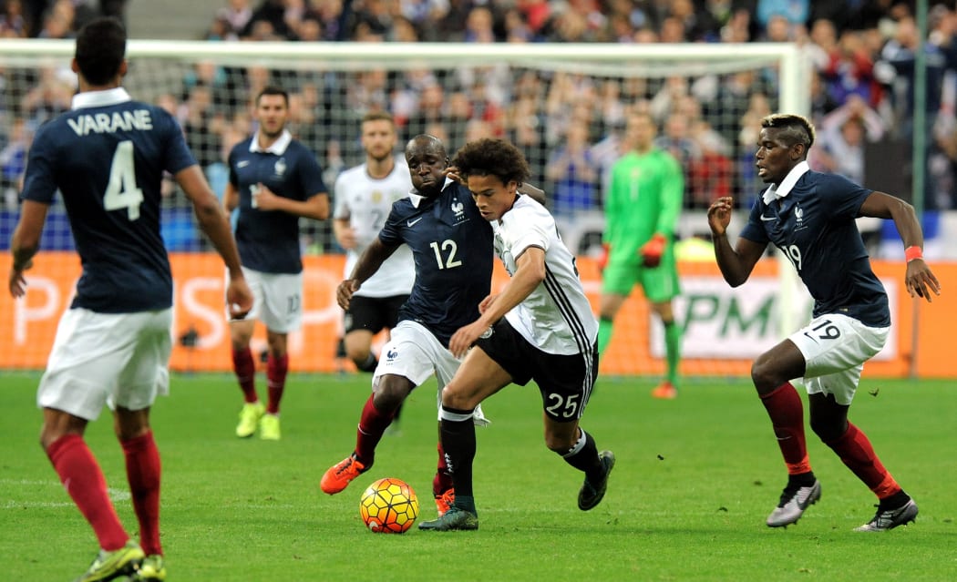 Leroy Sane of Germany and Lassana Diarra of France tussle during the friendly at the Stade de France, Paris on the 13th of November 2015. Photo Craig Cowie / BPI / DPPI