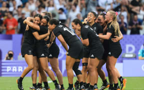 New Zealand Black Ferns Sevens players celebrate winning the Olympics final against Canada, in Paris, 30 July 2024.