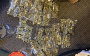 Police search warrants uncovered 2.5kg of cannabis, cash and LSD.